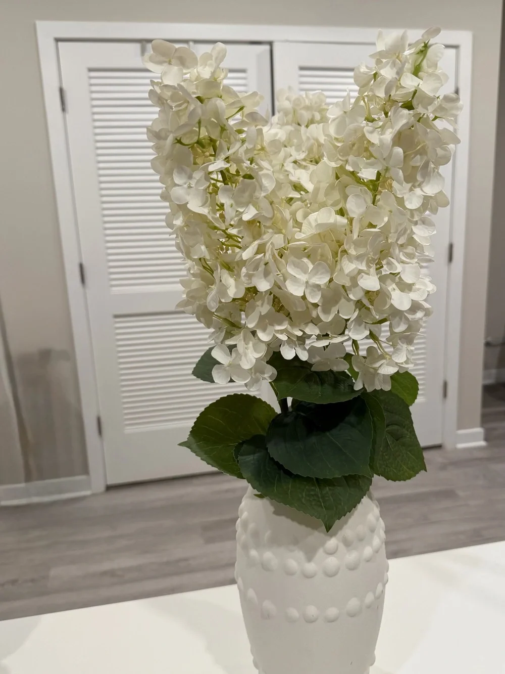 White Hydrangea Stem in White Decorative Vase - Brand Unknown